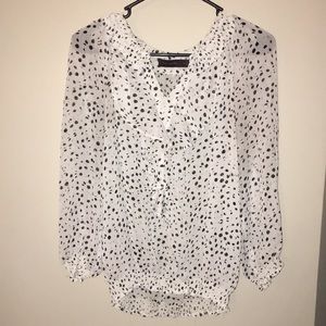 White and black polka-dot blouse